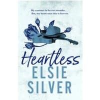"Heartless" book by Elsie Silver, blue cover with a cowboy hat and roses illustration.