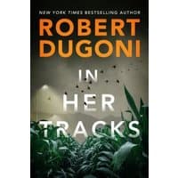Book cover of "In Her Tracks" by Robert Dugoni, featuring tall grass and spotlights against a dark, cloudy sky.