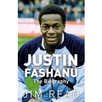 "Justin Fashanu: The Biography" book with cover photo of smiling man in sports jacket on football field.