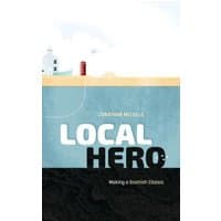 "Book titled 'Local Hero' with a lighthouse illustration on a blue and beige cover."