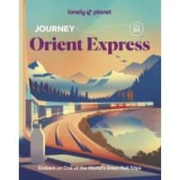 Lonely Planet Journey Orient Express book with illustrated train, mountains, and sunset on cover.