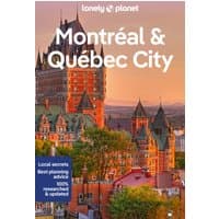 Lonely Planet travel guide with Château Frontenac at sunset, featuring local secrets and planning advice.