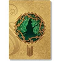 A4 dot grid cahier with gold ornate cover, featuring a green silhouette of a witch inside a circular design.