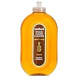 Clear oval bottle of Method Wood Floor Cleaner with orange liquid and almond scent label, 739 ml capacity.
