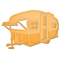 Wooden die-cut of a vintage camper with window, door, and awning details, by Spellbinders.