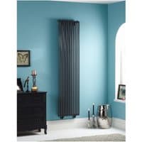 Gun metal vertical radiator, 1800mm x 465mm, sleek design with parallel bars, mounted on a blue wall.