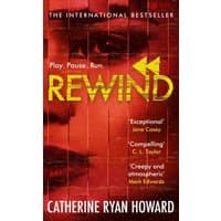 "Red book cover titled 'Rewind' by Catherine Ryan Howard with yellow text and blurred face background"