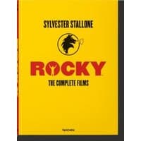 Yellow "Rocky" book by MGM, featuring a black silhouette of a boxer and bold red title text.