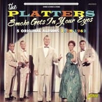 "Vinyl record 'Smoke Gets in Your Eyes' by Vinyl Castle, cover features The Platters in formal attire on stage."