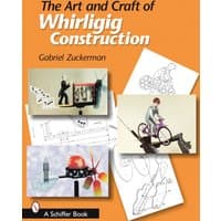 "The Art and Craft of Whirligig Construction" book with illustrated whirligigs and design sketches on the cover.