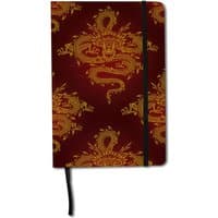 Red journal with gold dragon pattern, black elastic closure, and ribbon bookmark.