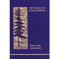 Blue book cover with gold tree illustration, titled "The Problem of the Puer Aeternus" by Marie-Louise von Franz.