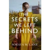 Book cover of "The Secrets We Left Behind" featuring a woman in a yellow dress facing a rural landscape.