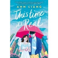 Book cover of "This Time It's Real" by Ann Liang, featuring a couple under a red umbrella with a cityscape background.