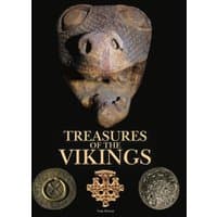 "Treasures of the Vikings" book with Viking artifacts on black cover, featuring a carved wooden face and ancient coins.