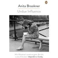 "Undue Influence" by Anita Brookner, paperback with black-and-white cover of woman reading on a bench.