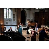Candlelight concert ticket for Vivaldi's Four Seasons at St Giles Cathedral, featuring musicians with string instruments.