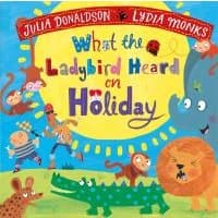 Colorful children's book cover with animals, sun, and text "What the Ladybird Heard on Holiday" by Julia Donaldson.