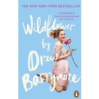 "Wildflower book by Drew Barrymore, light blue cover, features Drew in a pink dress holding a pink flower"