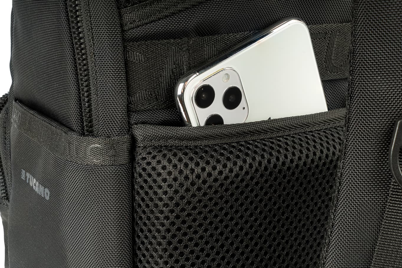 Black Tucano Terra Gravity Backpack featuring durable fabric, mesh pocket, and a visible smartphone peeking from the side pocket.