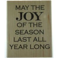 Wooden plaque with black text reading "May the Joy of the Season Last All Year Long."