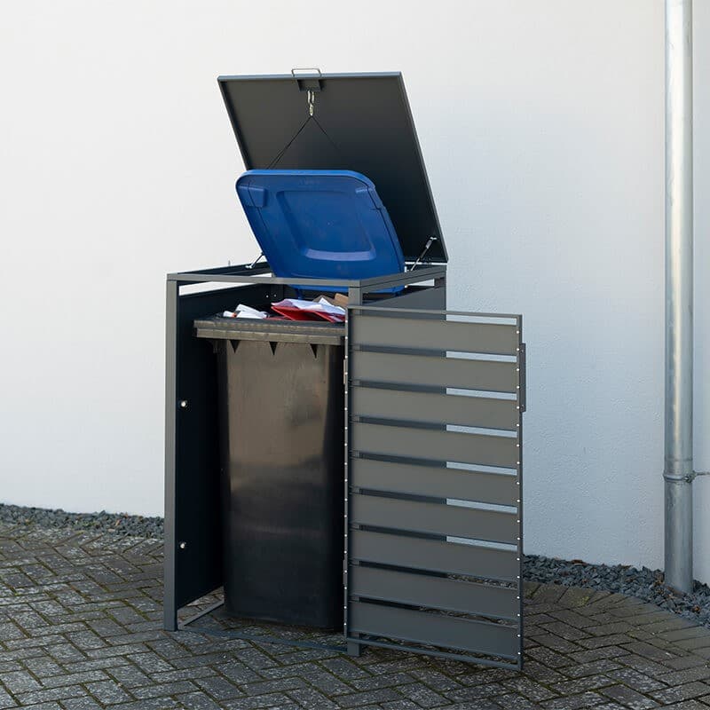Anthracite metal wheelie bin store with a slatted design, featuring a hinged lid and side access, accommodating a 240L bin, set against a neutral wall.