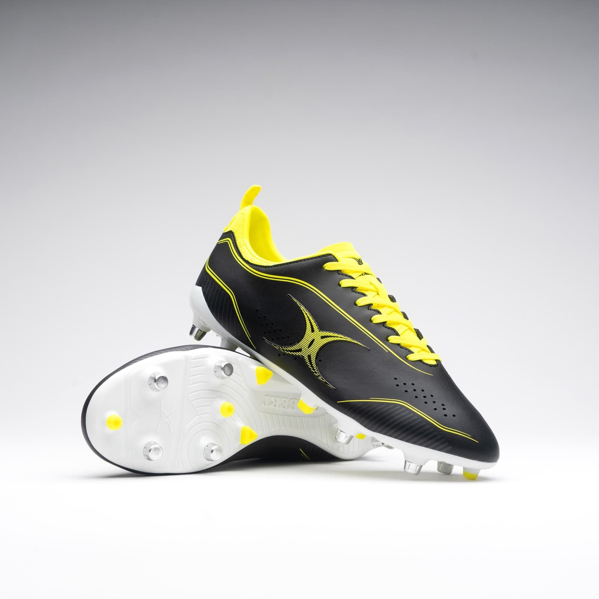 Black and fluo yellow Gilbert Rugby Cage Torq 6S boots featuring a sleek design, textured upper, and molded studs for traction on the field.