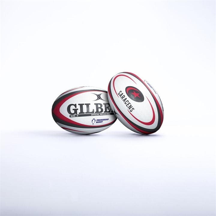 Black rugby ball with white and red accents, featuring "GILBERT" logo and "SARACENS" emblem, made from durable synthetic material for enhanced grip and performance.