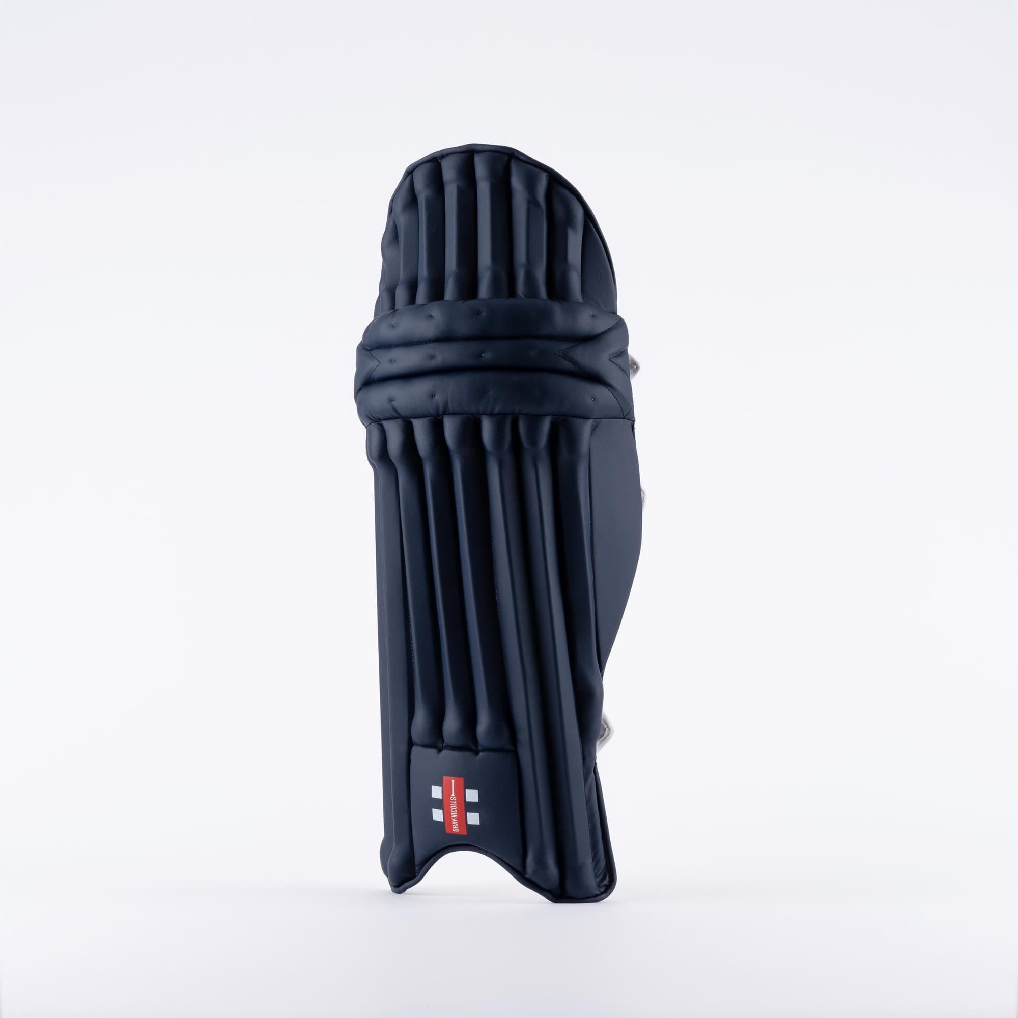 Gray-Nicolls Prestige Batting Pads in black, featuring a sleek design with vertical grooves, lightweight construction, and reinforced edges for enhanced protection.