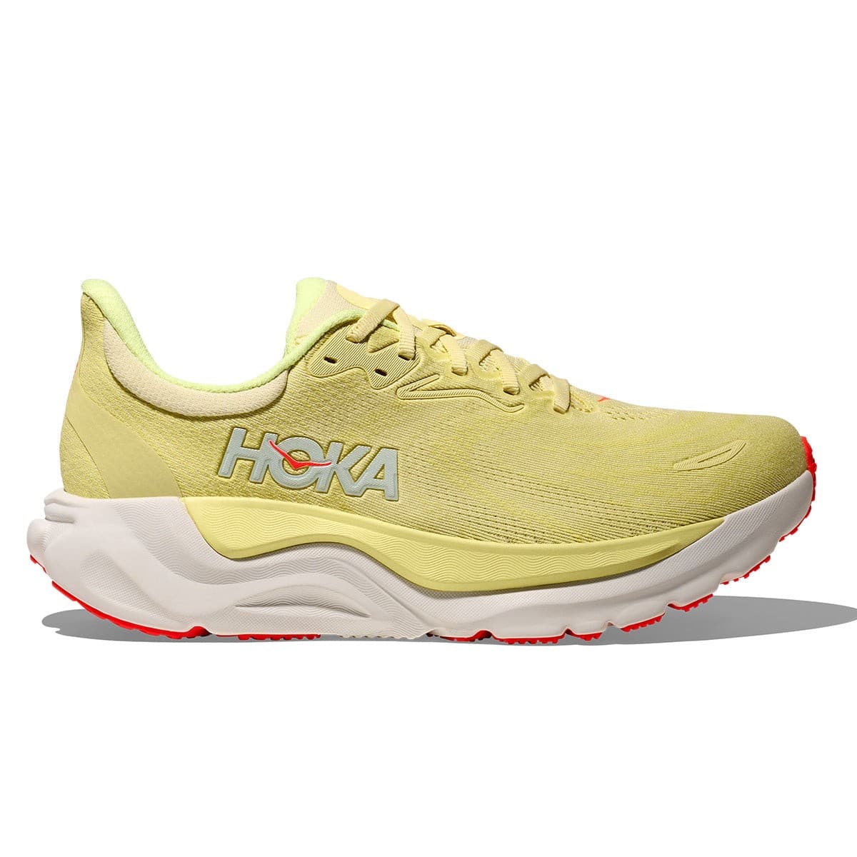 Light yellow synthetic running shoe with a neon yuzu accent, featuring a cushioned sole, breathable mesh upper, and HOKA logo prominently displayed on the side.