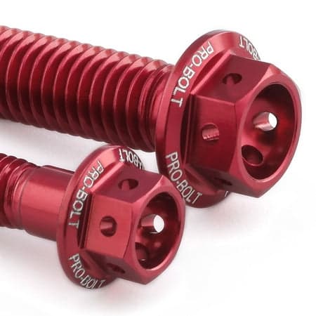 Red anodized aluminum rear brake line clip mount bolts with hexagonal heads, featuring engraved "PRO-BOLT" branding and a sleek finish.