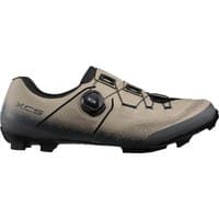 Beige Shimano XC5 MTB cycling shoes with black accents, BOA dial closure, and rugged tread sole.