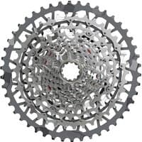 Silver SRAM XG-1351 XPLR E1 13-speed cassette with intricate gear pattern and open center design.