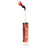 Stans Tubeless Sealant Injector with clear syringe, red and black label, and flexible tube with red valve.