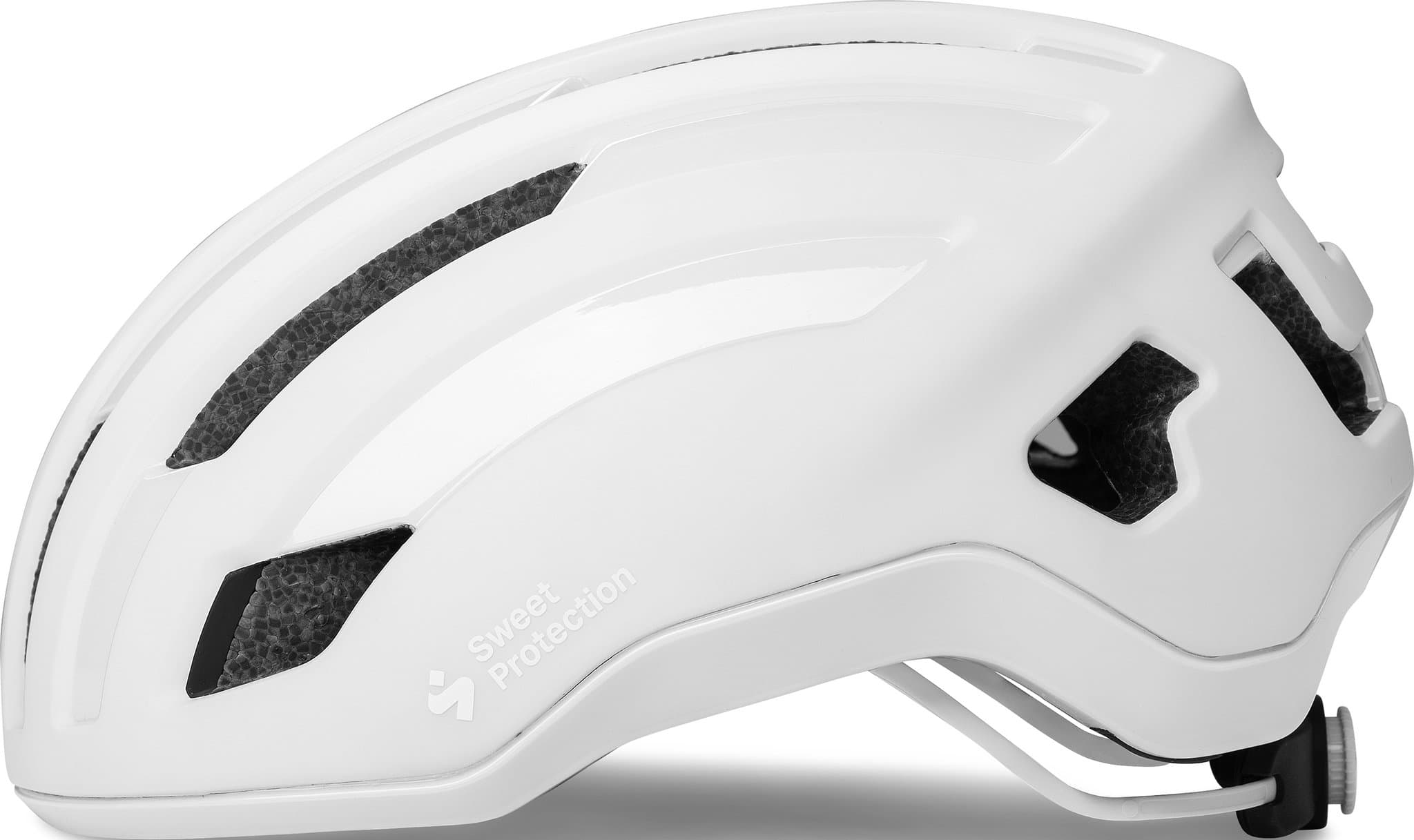 Matte white Sweet Protection Outrider MIPS helmet in size medium, featuring a sleek design, ventilation slots, and a secure adjustment system for comfort and safety.
