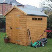 Wooden garden shed with shiplap cladding, apex roof, single door, and small windows, surrounded by garden tools.