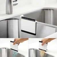 White Avilo 2 in 1 Counter Top Wiper with black bristles and rubber edge, shown cleaning sink and countertop.