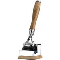 Carthusia Fusion Razor with polished metal head and wooden handle, resting on a matching wooden and metal stand.