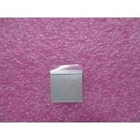 HP L71971-001 laptop USB board, compact silver square with connector port, on pink textured background.