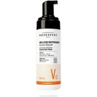 White Novexpert Flash Eclat Mousse Nettoyant bottle with black pump, orange accents, 150 ml, anti-aging face foam.