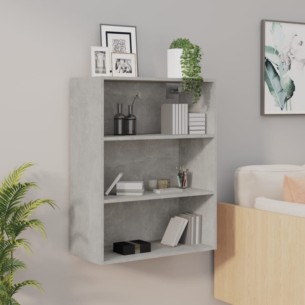 Concrete grey hanging wall cabinet featuring three open shelves, decorative items, a potted plant, and framed pictures, designed for modern interior spaces.