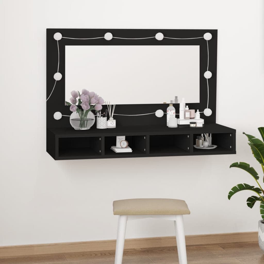 Black mirror cabinet with LED lights, featuring a large rectangular mirror and open shelves, complemented by a minimalist design and a neutral-toned stool in front.
