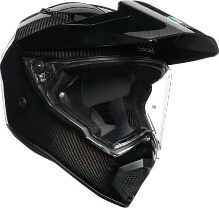 Black carbon fiber AGV AX-9 Mono Carbon 06 helmet in size M, featuring a clear visor, aerodynamic design, and a prominent front peak for enhanced visibility and protection.