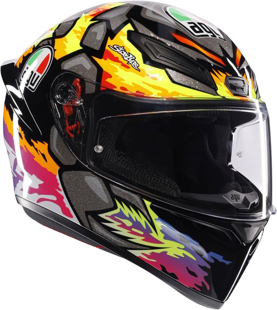 AGV K1-S Bezzecchi 2023 full face helmet in vibrant black, orange, and yellow with striking graphic designs, featuring a clear visor and aerodynamic shape.