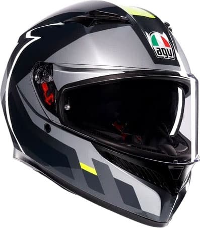 Full face helmet in grey with fluo yellow accents, featuring a sleek aerodynamic design, clear visor, and AGV logo prominently displayed on the front.