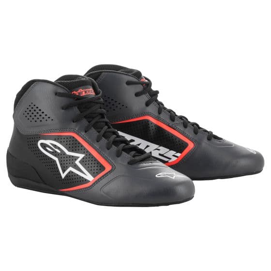 Alpinestars Tech 1-K Start V2 kart boots in black with fluro orange accents, featuring a sleek design, breathable mesh panels, and a prominent logo on the side.
