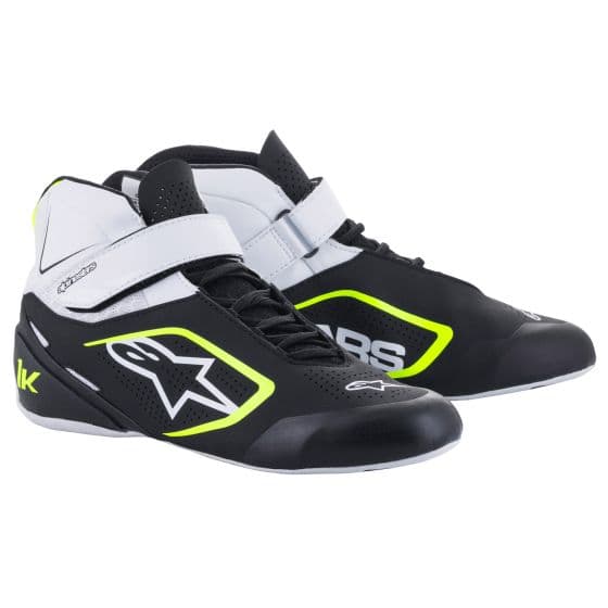 Black and white kart boots with fluro yellow accents, featuring a sleek design, Velcro strap, and a lightweight, durable material, size UK 6 / EUR 39.