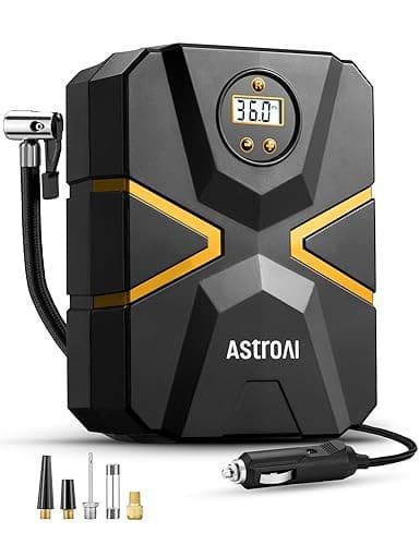 Portable black and gold AstroAI S1 tire inflator with a digital display showing 36.0 PSI, includes nozzles and a 12V DC power cord for easy car use.