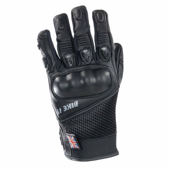 Black motorcycle gloves featuring a textured palm, knuckle protection, and mesh panels for breathability, with a small Union Jack emblem on the wrist.