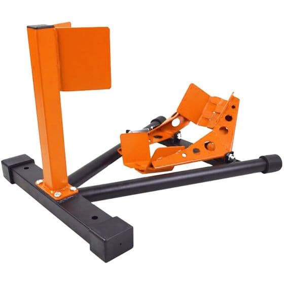 Black and orange motorcycle wheel chock featuring a sturdy metal frame, adjustable support, and rubber feet for stability, designed for secure bike parking.